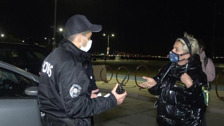 Maskesiz gezen kadın işlem yapan polislere tepki gösterdi